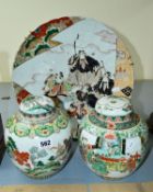 A MATCHED PAIR OF FAMILLE VERTE GINGER JARS AND COVERS, one cover damaged and with glued repairs,