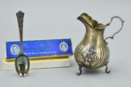 AN EARLY VICTORIAN SILVER CREAM JUG AND A MAPPIN & WEBB CORONATION SPOON, the jug of bellied form