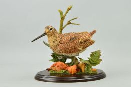 A COUNTRY ARTISTS SCULPTURE, 'Woodcock with Autumn Leaves and Fern' No.01690 on wooden plinth,
