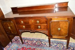 AN EARLY 20TH CENTURY MAHOGANY SIDEBOARD, with a raised back, two long drawers central to the