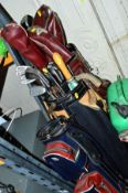 THREE GOLF BAGS CONTAINING VARIOUS CLUBS