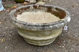 A COMPOSITE CIRCULAR GARDEN PLANT POT, approximate diameter 60cm