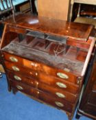 A GEORGIAN FLAME MAHOGANY FALL FRONT BUREAU, with fitted interior above four drawers, with brass
