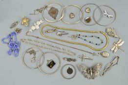 A SELECTION OF JEWELLERY, to include three late 19th to early 20th Century silver brooches, all