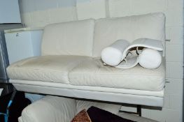 A CREAM LEATHER FOUR SECTION CORNER SOFA, with headrests
