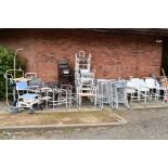 A LARGE COLLECTION OF MEDICAL EQUIPMENT, including zimmer frames, commodes, walking sticks and hoist