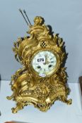 A LATE 19TH/EARLY 20TH CENTURY GILT BRASS MANTEL CLOCK, eight day movement, bell strike, height 34.