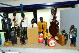 A GROUP OF CERAMIC FIGURES OF JAZZ MUSICIANS, some with drums, piano, etc (twelve + accessories)