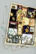 A SELECTION OF JEWELLERY, to include a pair of purple paste cufflinks, a faceted crystal necklace,