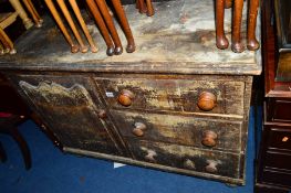 A VICTORIAN BRUSH GRAINED PINE SIDEBOARD, with three drawers and a single cupboard with walnut