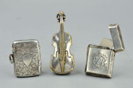 A VICTORIAN SILVER VESTA CASE OF RECTANGULAR FORM, Birmingham 1883, together with another engraved