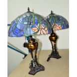 A PAIR OF MODERN TABLE LAMPS WITH TIFFANY STYLE LEADED GLASS SHADES, on metal bases (2)