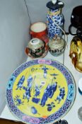 A 19TH CENTURY CHINESE PORCELAIN CHARGER, painted with an acrobtic team, extensive damage to rim,
