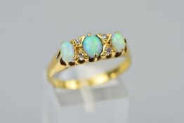 AN OPAL AND DIAMOND RING, designed as three oval opal cabochons, opal lengths 5mm-6mm, with four