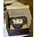 A WWII ERA BRITISH GAS MASK, this example being contained in the usual card box, but then inside a