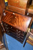 A REPRODUCTION MAHOGANY FALL FRONT BUREAU, with four drawers