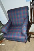 A TARTAN UPHOLSTERED MODERN ARMCHAIR