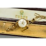 A 9CT GOLD TUDOR WRISTWATCH, the circular dial with baqton hour markers to the open link strap,