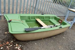 A BIC SPORT 252 FIBRE GLASS AND PLASTER DINGHY, with two oars, approximate size 246cm x 121cm