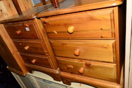 A PAIR OF PINE THREE DRAWER BEDSIDE CHESTS
