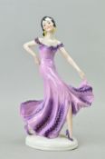 AN ART DECO STYLE PORCELAIN FIGURE, flamenco dancer in purple dress, height approximately 27cm (shoe