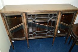 AN EDWARDIAN MAHOGANY ASTRAGAL GLAZED THREE DOOR BOOKCASE, with adjustable shelves on square