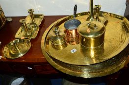 A QUANTITY OF BRASS, to include two large platter plates, five candle holders, etc (9)