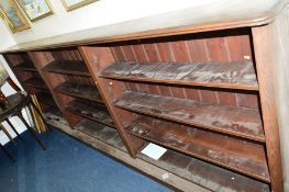 A LONG EARLY 20TH CENTURY OAK THREE BAY OPEN BOOKCASE, with adjustable shelves, approximate size
