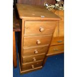 A SLIM PINE CHEST OF FIVE DRAWERS together with three various table lamps and an onyx standard