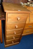 A SLIM PINE CHEST OF FIVE DRAWERS together with three various table lamps and an onyx standard