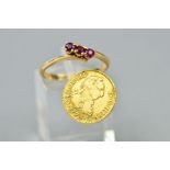 A RUBY RING AND A COIN, the ring of cross-over design, claw set with three circular rubies,
