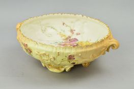 A ROYAL WORCESTER BLUSH IVORY TWIN HANDLED FOOTED BOWL, florally decorated, printed puce factory