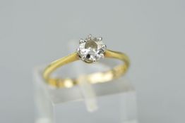 A SOLITAIRE DIAMOND RING, the round brilliant cut diamond within an eight claw setting,