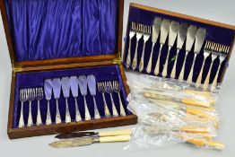 AN OAK CASED SET OF TWELVE SILVER PLATED FISH EATERS, together with other fish eaters loose (2)