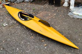 A YELLOW CANOE, with double oars