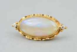 A MODERN OPAL AND DIAMOND BROOCH, centering on an oval measuring approximately 23.0mm x 11.7mm,
