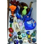 A QUANTITY OF COLOURED GLASSWARE, including modern paperweights, flower baskets, vases, Wedgwood