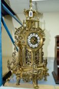 A REPRODUCTION BRASS CASED MANTEL CLOCK WITH QUARTZ MOVEMENT, approximate height 56cm