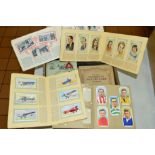 A COLLECTION OF CIGARETTE CARDS, loosely inserted and stuck into albums, to include Wills