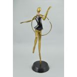 A DECO STYLE BRASS AND BRONZED FIGURE WITH A HOOP, approximate height 59cm (hoop broken and foot