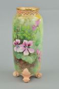 A ROYAL WORCESTER OVOID VASE, painted with Clematis flowers, pierced rim, leafy scroll feet,