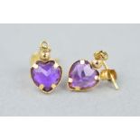 A PAIR OF AMETHYST DROP EARRINGS, each designed as a suspended heart shape amethyst within a plain