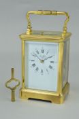 A LATE 20TH CENTURY BRASS CASED CARRIAGE CLOCK, enamel dial with Roman numerals, signed St.James,