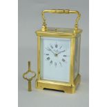 A LATE 20TH CENTURY BRASS CASED CARRIAGE CLOCK, enamel dial with Roman numerals, signed St.James,