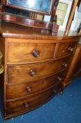 A VICTORIAN WALNUT BOWFRONT CHEST OF TWO SHORT AND THREE LONG DRAWERS, with turned handles,
