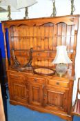 A PINE KITCHEN DRESSER, with two tier plate rack, six various drawers and triple cupboard,