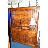 A PINE KITCHEN DRESSER, with two tier plate rack, six various drawers and triple cupboard,