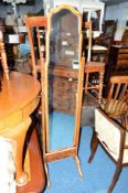 A 20TH CENTURY WALNUT CHEVAL MIRROR, on brass casters, approximate height 172cm together with a