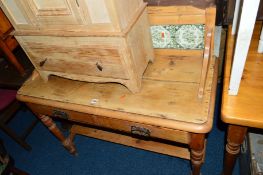 A VICTORIAN PINE WASHSTAND, with tiled back and two drawers