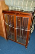 A MAHOGANY GLAZED TWO DOOR CHINA CABINET, a mahogany swing mirror and five various table lamps